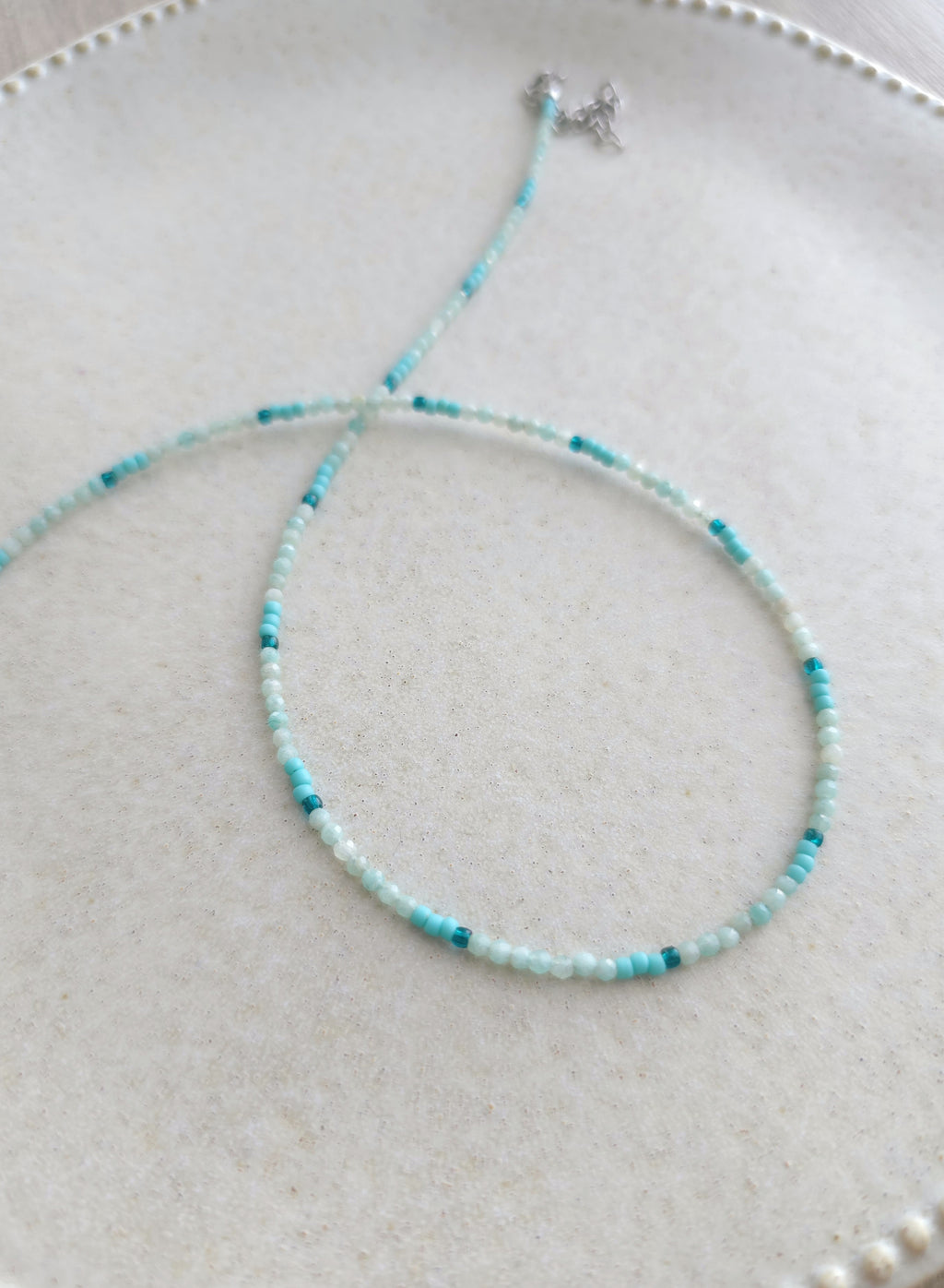 adjustable length tiny beads necklace in light blue color