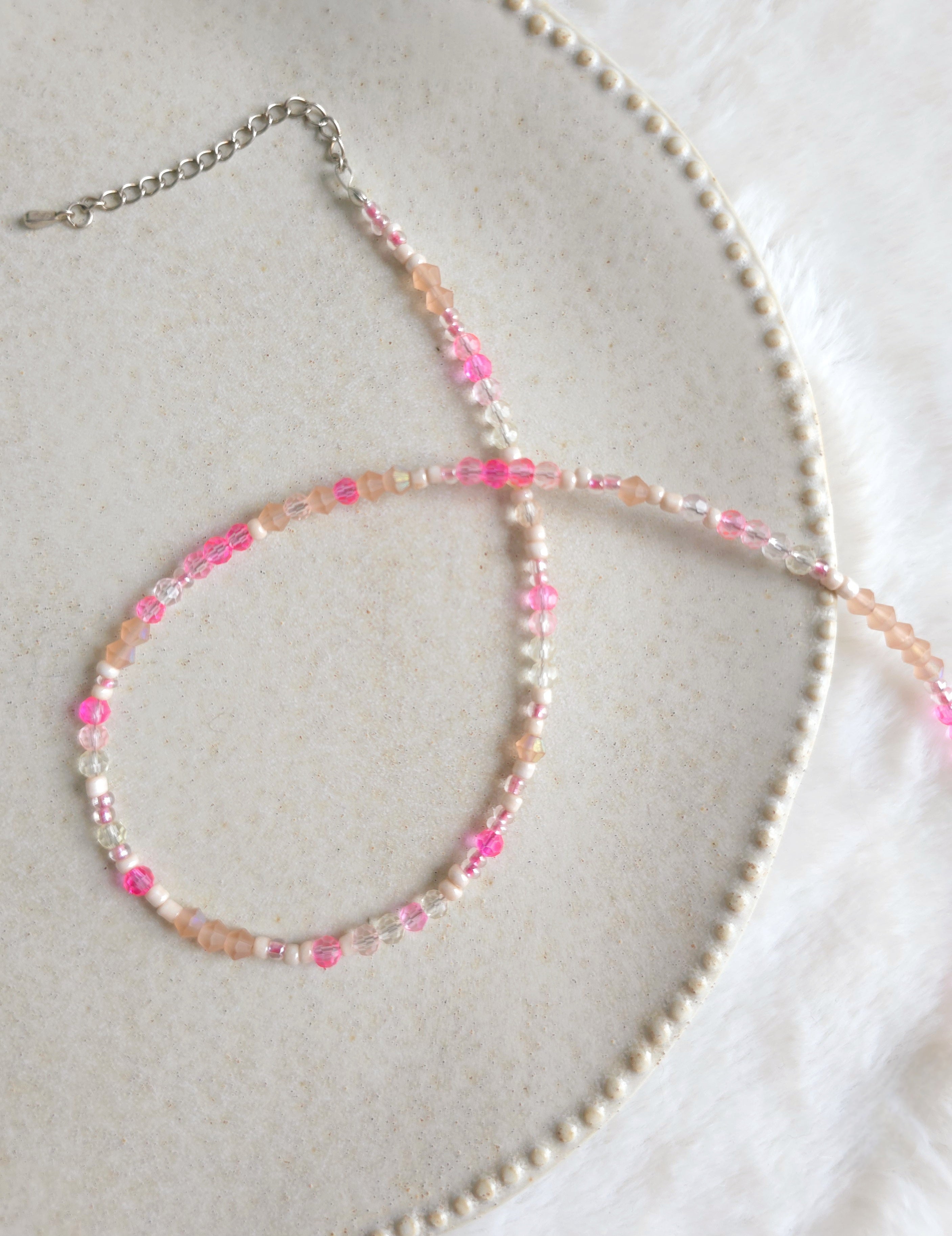 Light pink and beige thin strand necklace with adjustable length